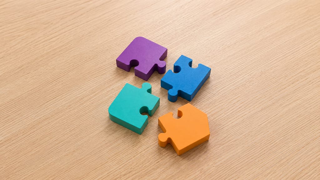 Four colorful puzzle pieces representing the interconnected elements of an estate plan