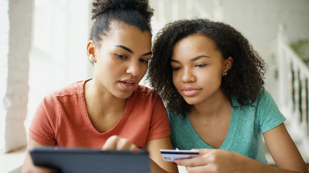 Two young women reviewing a Young Adult Power of Attorney together before heading off to college