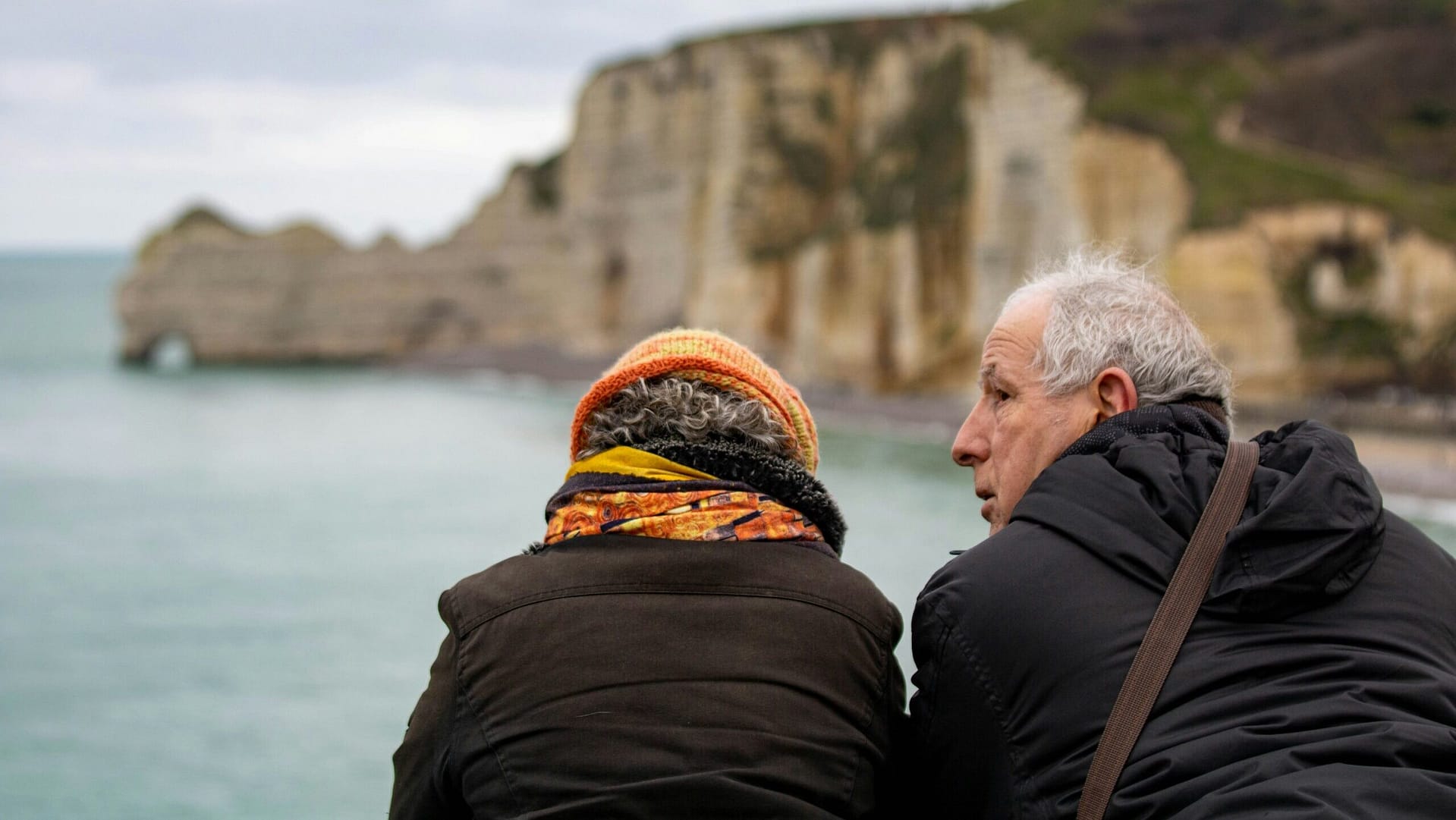 Two older adults looking out at the horizon, representing estate planning decisions for people without children in Indiana