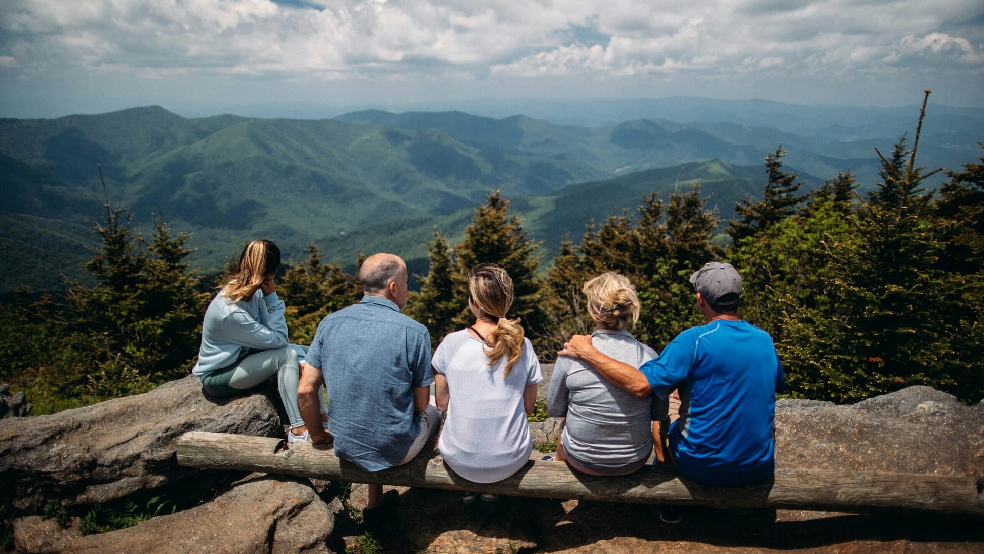 Family of five sitting together on a mountain overlook, looking ahead — probate and estate planning guidance for Indiana families