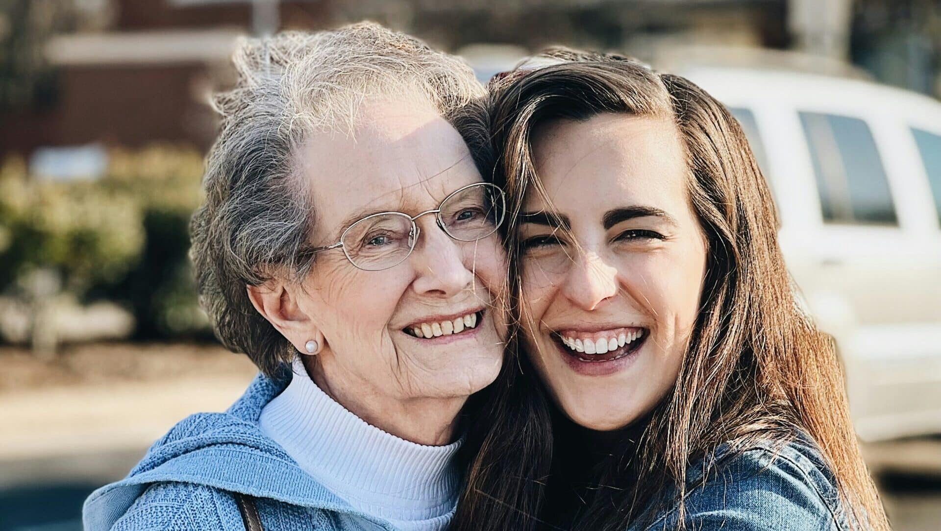 A daughter and her aging mother at home discussing in-place care options in Indiana.