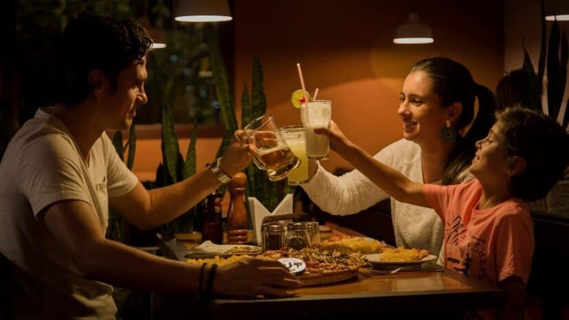 Young couple celebrating at dinner — estate planning for young families in Indiana gives you peace of mind